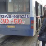 GAS SALE, bus back panel advertising